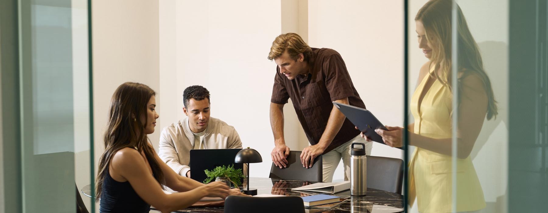 a group of people in a meeting